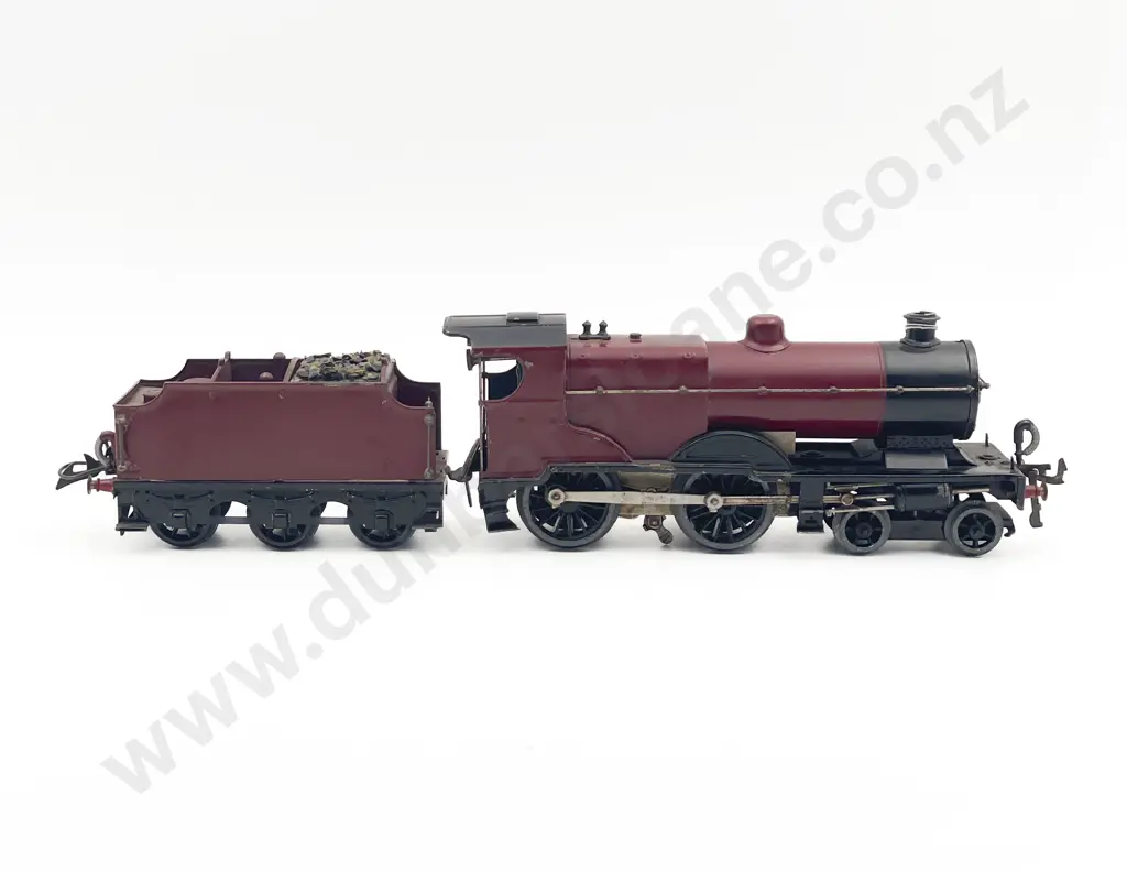 Unidentified O Gauge Clockwork Locomotive and 6-wheel Tender Image 1++