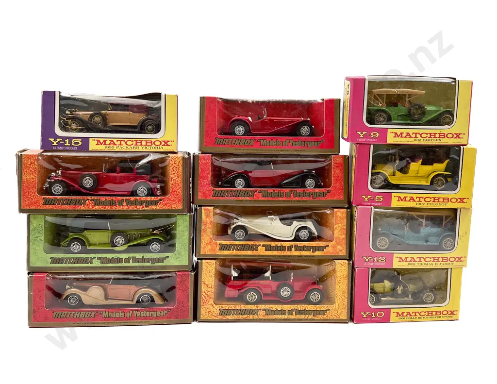 Twelve MIxed Pink Purple and Woodgrain Surround Boxed Vintage Model Vehicles Image 1++