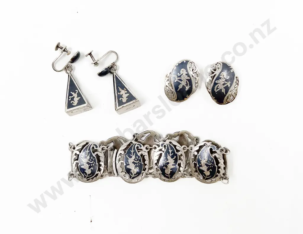 Small Silver Bracelet Together with Matching Earrings Image 1++