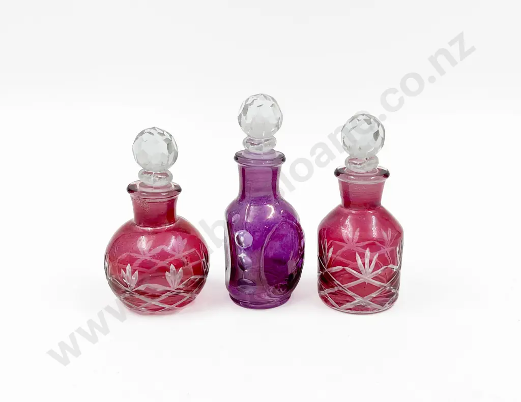 Three Small Coloured Glass Vanity Bottles Image 1++