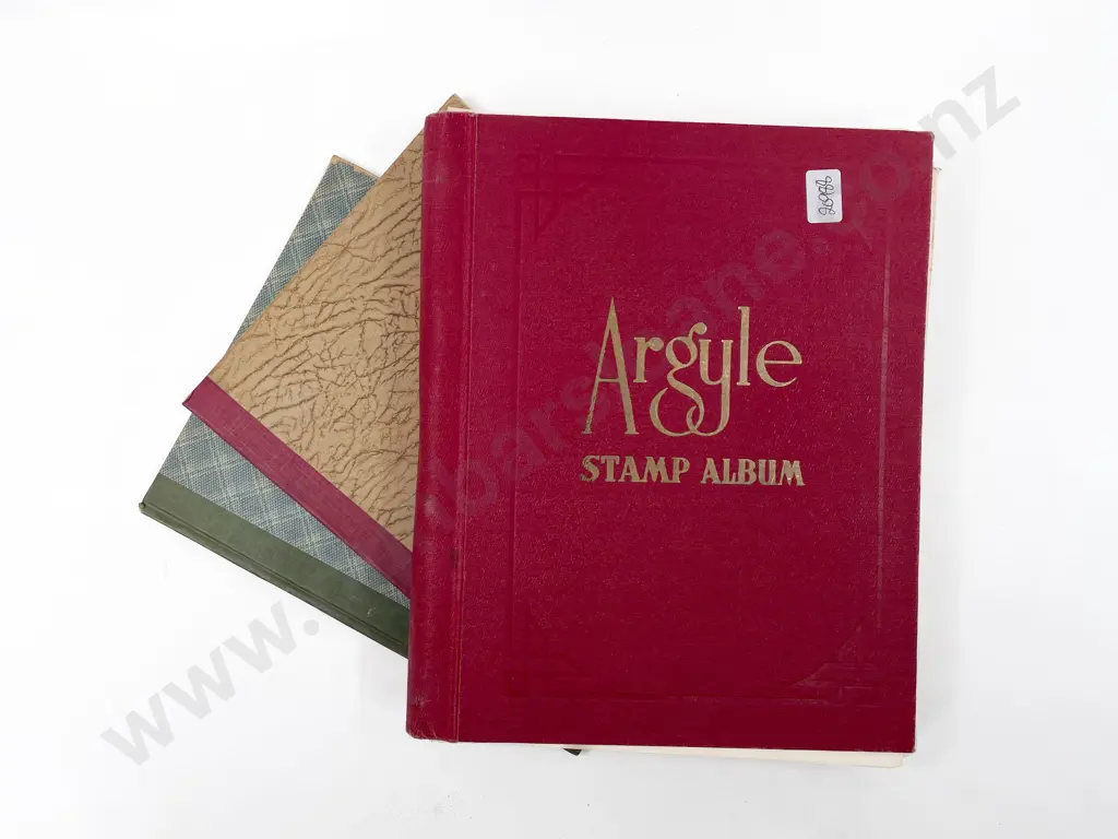 Three Assorted Stamp Albums Image 1++