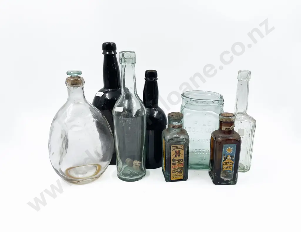 Collection of Antique Bottles Including Indian Rubber Company Pouring Jar Image 1++