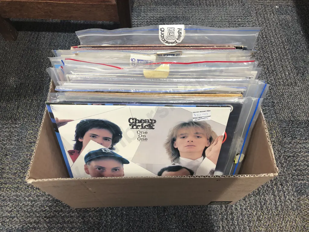 Box of Assorted Vinyl Records Including Cheap Trick and Dire Straits Image 1++