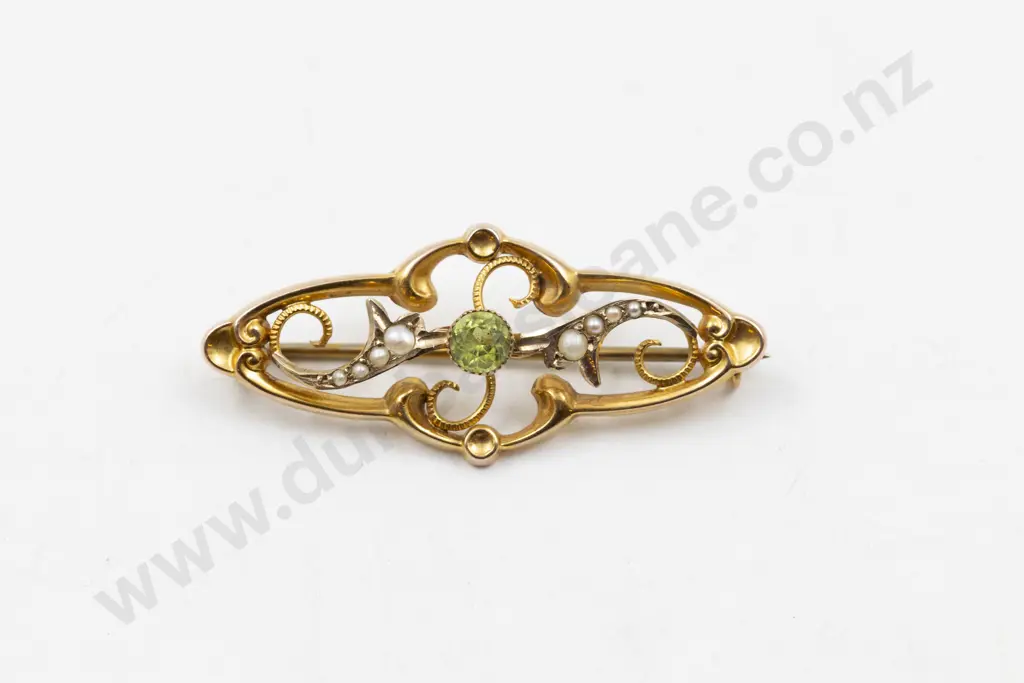 Edwardian 9ct Peridot and Seed Pearl Scroll Brooch Image 1++