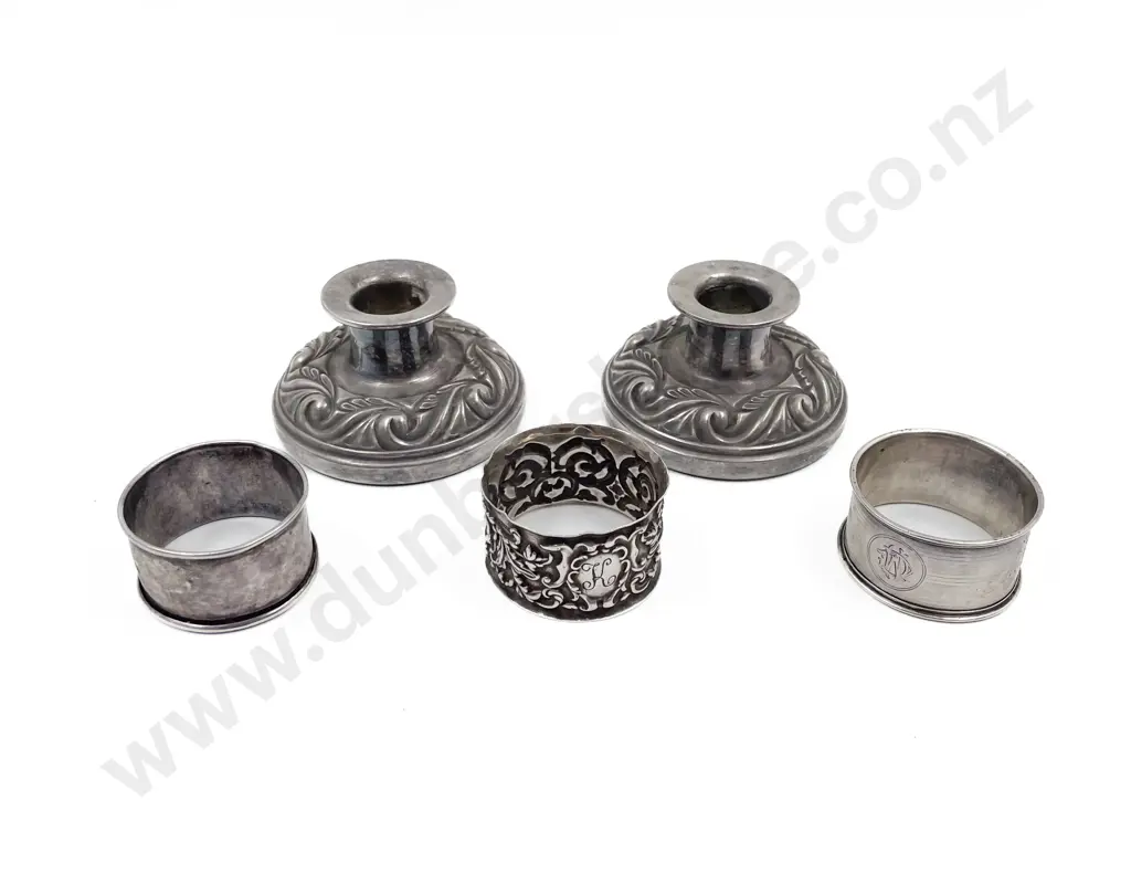 Three S/S Napkin Rings and pair Hecworth silver plate candlesticks Image 1++