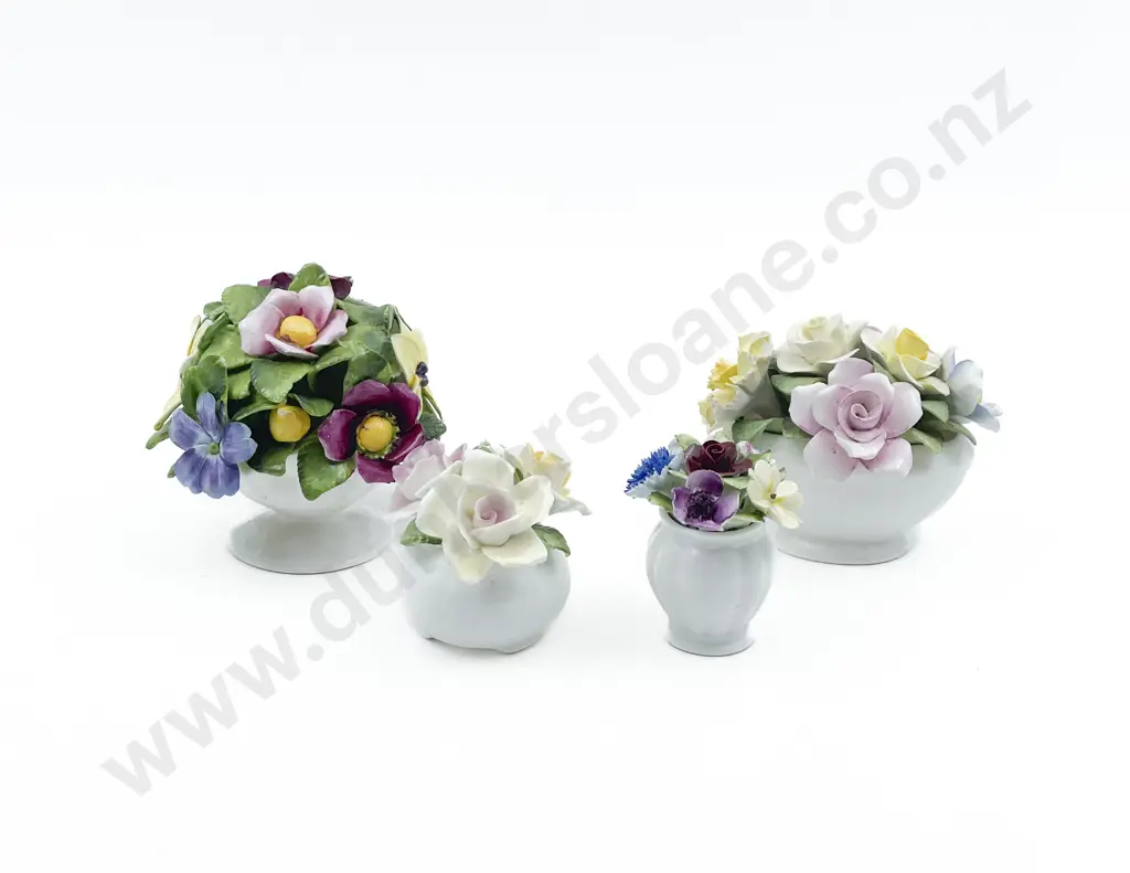Four Assorted Ceramic Flower Ornaments Image 1++