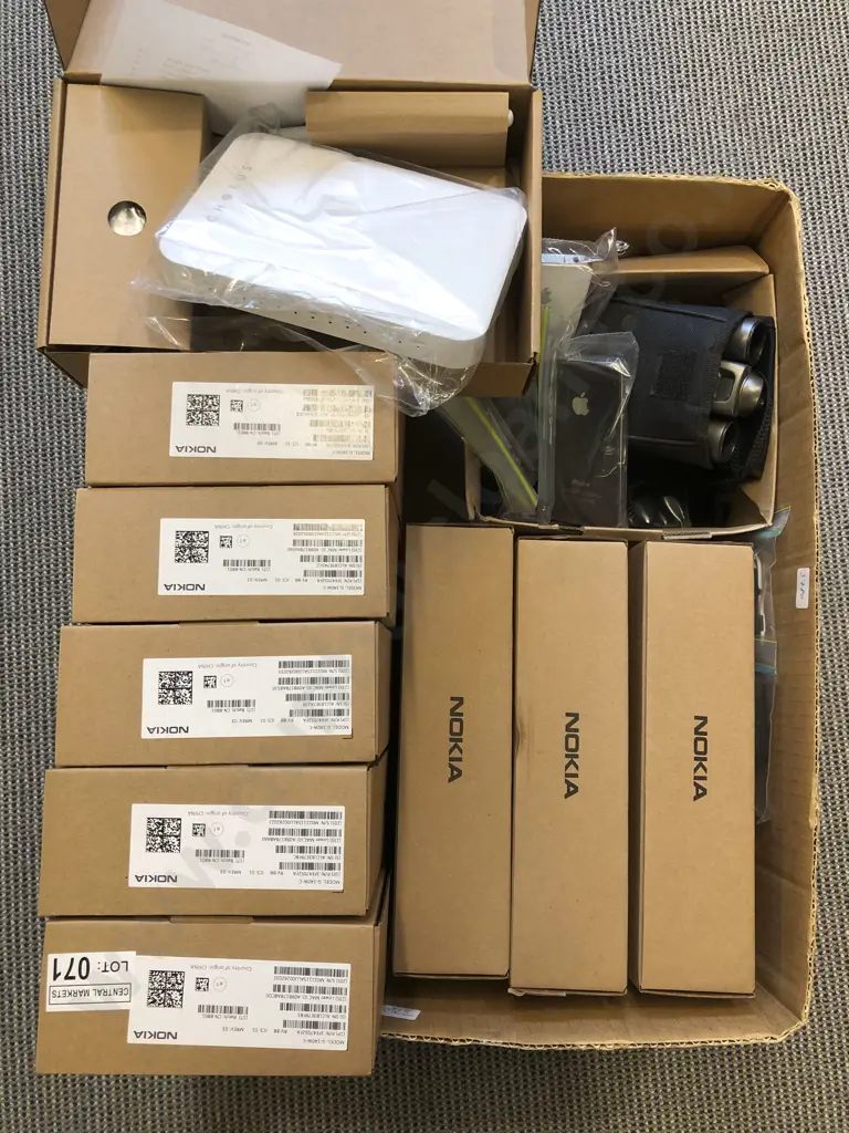 Box of Assorted Electronics Including Wifi Routers and Cellphones Image 1++