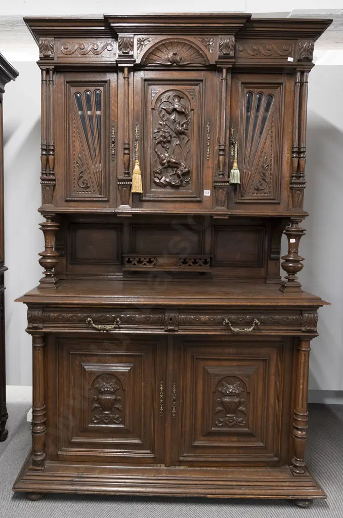 Late C19th European Oak Two Stage Dresser. The breakfront top with three doors central door carved with dragon Image 1++