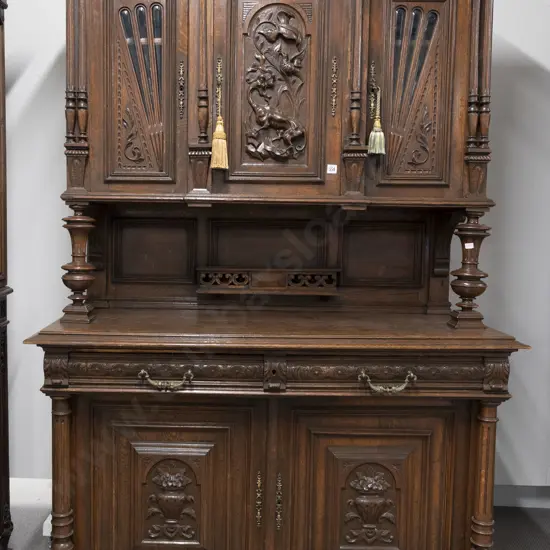 Late C19th European Oak Two Stage Dresser. The breakfront top with three doors central door carved with dragon
