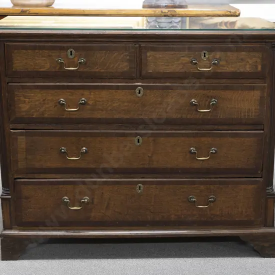 Geo III Oak and cross-banded flat front chest with two short and three long drawers