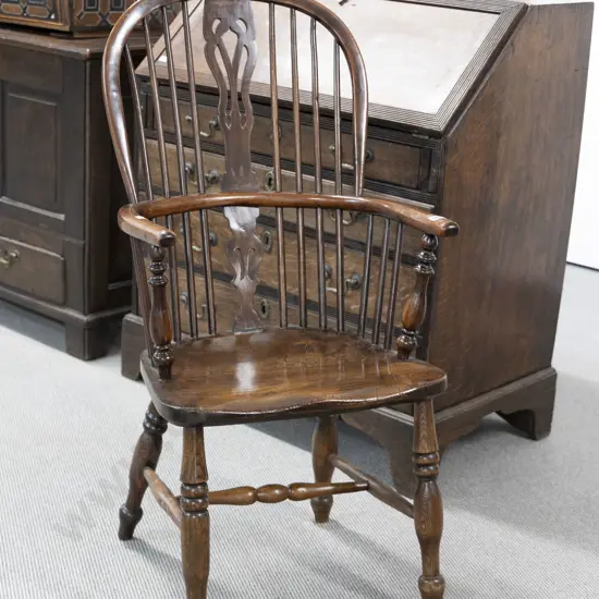 C19th Elm Windsor Chair of traditional form with pierced central splat