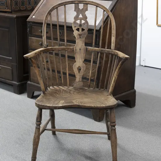C19th Elm Windsor Chair of traditional form with pierced central splat