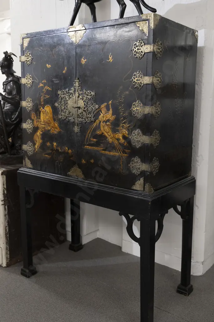 An Attractive Geo III Black Lacquered and Chinoiserie Cabinet on Stand the doors decorated with figures Image 1++