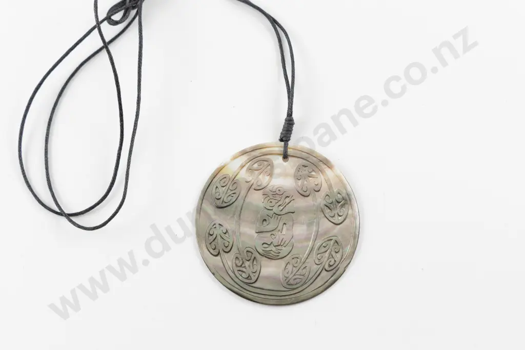 Mother of Pearl Tiki and Koru Carved Pendant Image 1++