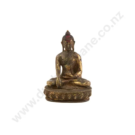 An Early 20th Century Tibetan Gilt Bronze Figure of Shakyamuni Buddha