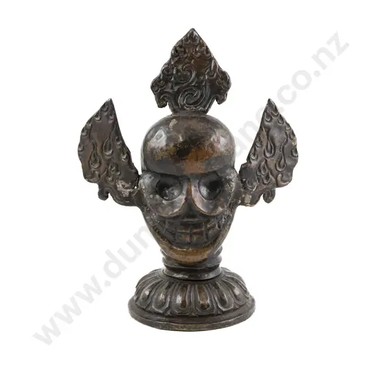 A Large and Unusual 19th Century Tibetan Cast Copper Skull Altar Figure