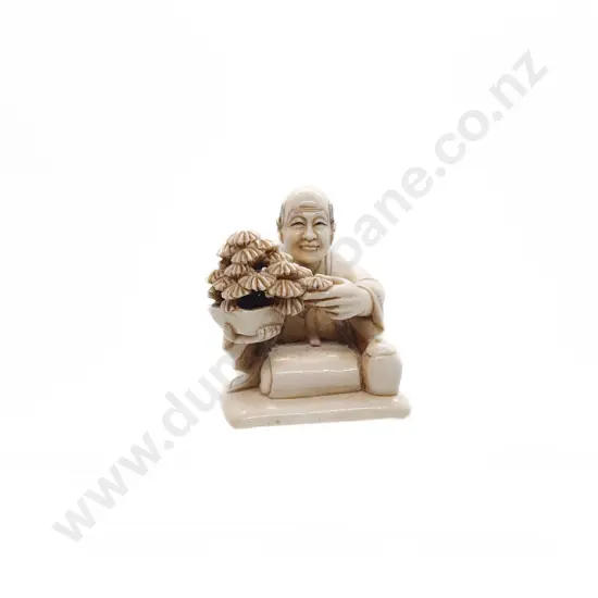 Signed Ivory Netsuke of a Kneeling Man at Bonsai