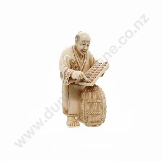 Signed Ivory Netsuke of Trader with Rice Bale and Abacus