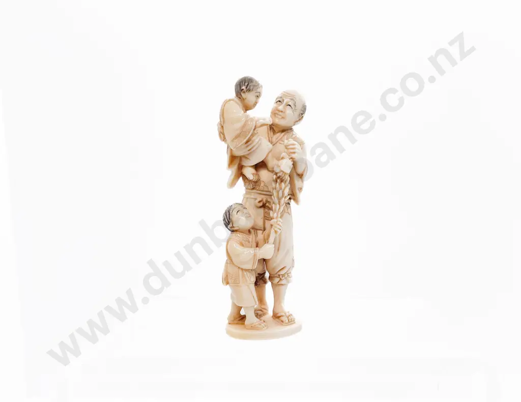 Signed Ivory Netsuke of a Grandfather with His Two Grandsons Image 1++