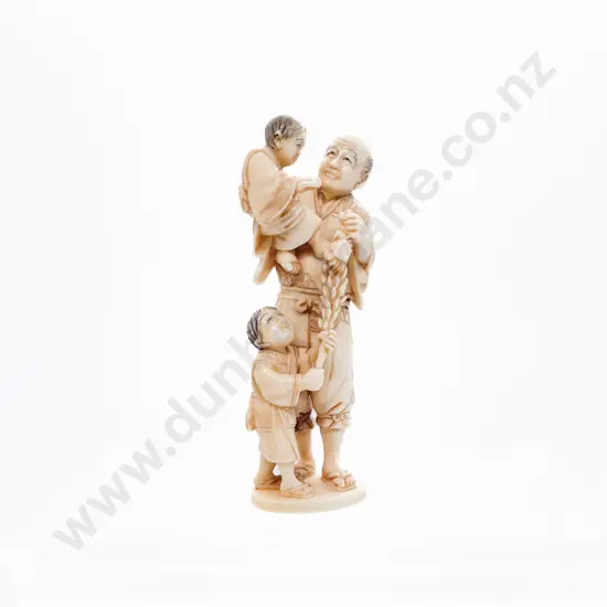 Signed Ivory Netsuke of a Grandfather with His Two Grandsons