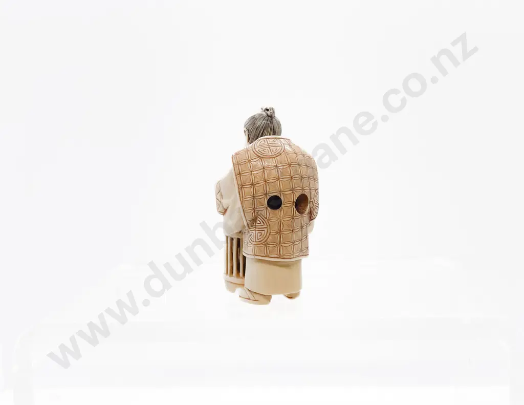 Signed and Stained Ivory Netsuke of a Trader with Basket of Quail Eating Soup Image 1++