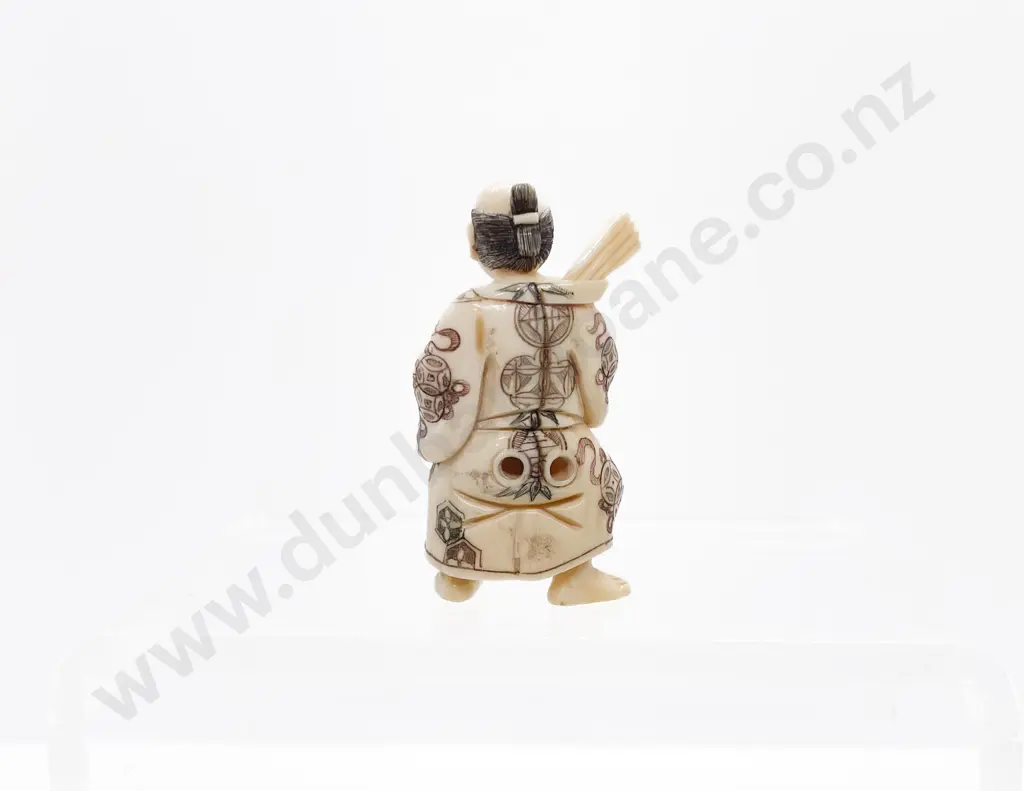 Signed and Stained Ivory Netsuke of a Actor Holding a Mask Image 1++