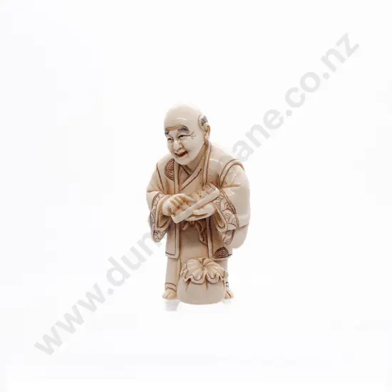 Signed Ivory Netsuke of a Trader with Abacus