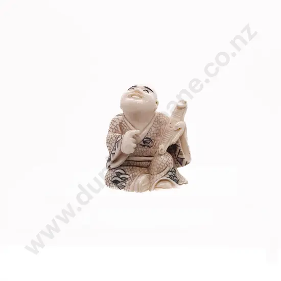 Signed and Stained Ivory Netsuke of a Seated Child Holding a Obi Hasami