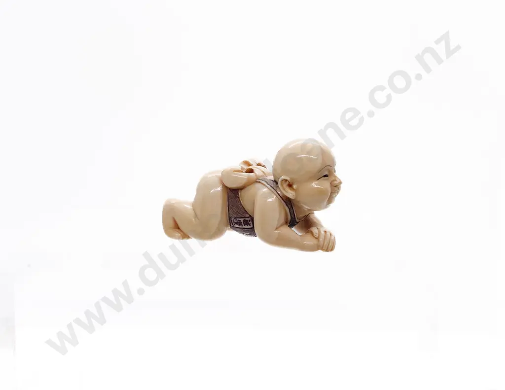 Signed and Stained Ivory Netsuke of a Male Child with MOP Inlaid Disc Image 1++