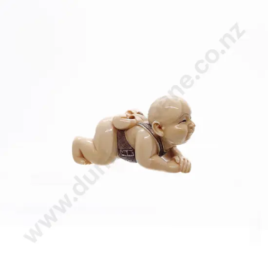 Signed and Stained Ivory Netsuke of a Male Child with MOP Inlaid Disc