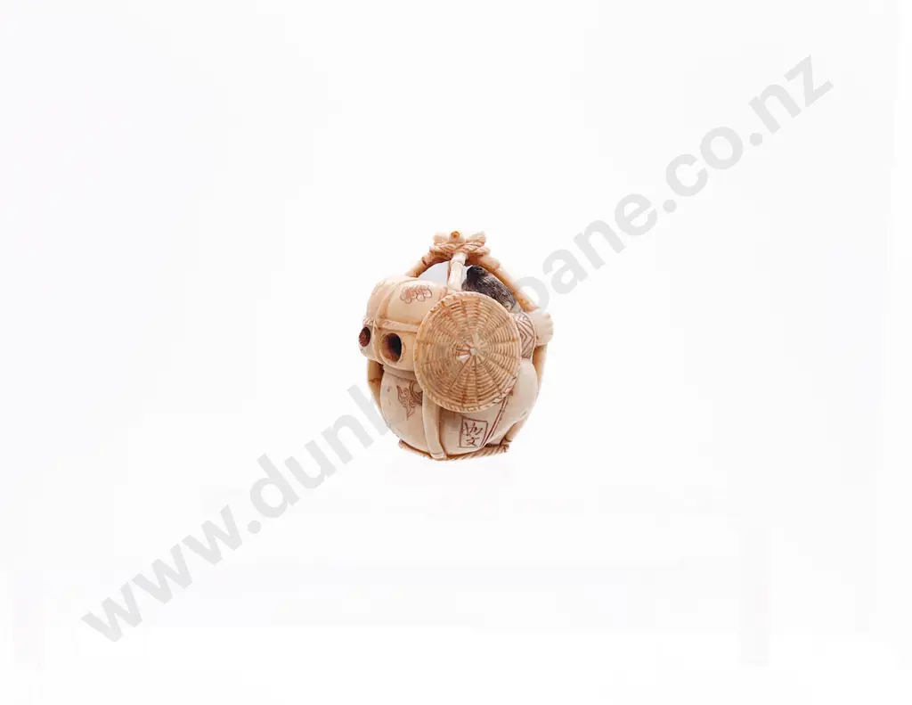 Signed and Stained Ivory Netsuke of a Traveller in a Basket Image 1++