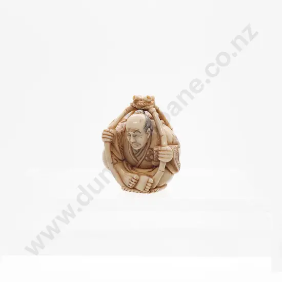 Signed and Stained Ivory Netsuke of a Traveller in a Basket