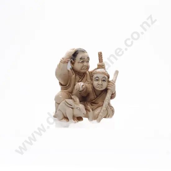 Signed and Stained Ivory Netsuke of a Old Samurai Seated with Apprentice and Rabbit