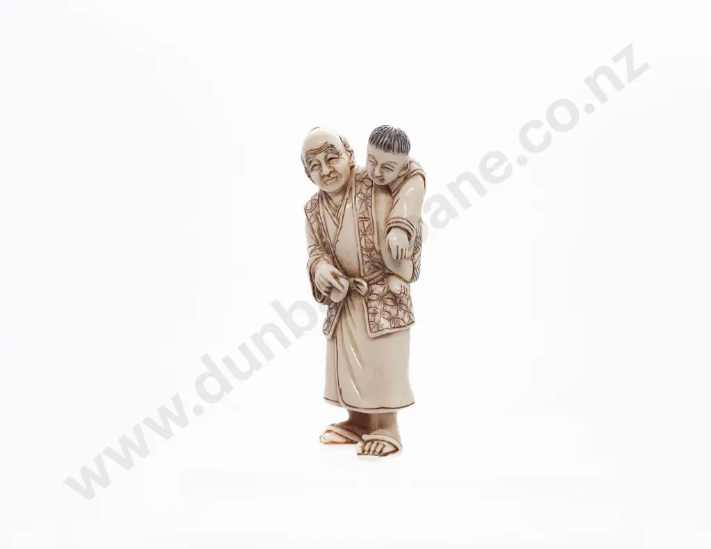 Signed and Stained Ivory Netsuke of a Standing Grandfather with Child on His Back Image 1++