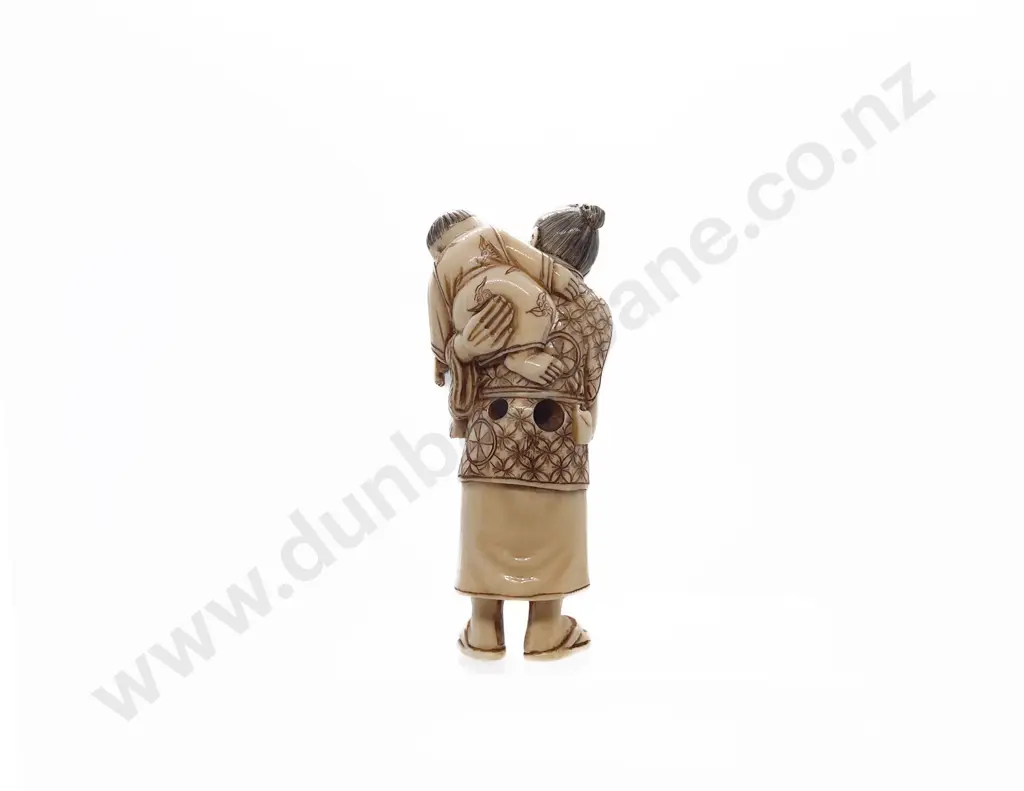 Signed and Stained Ivory Netsuke of a Standing Grandfather with Child on His Back Image 1++