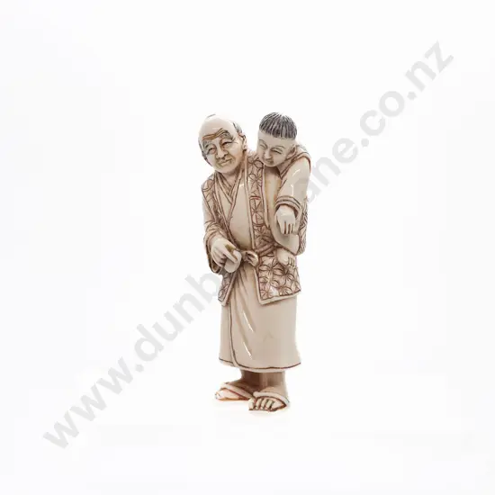 Signed and Stained Ivory Netsuke of a Standing Grandfather with Child on His Back