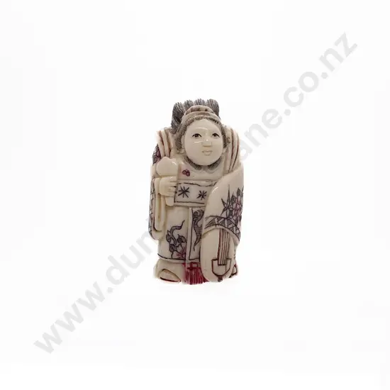 Stained Ivory Okimono of the Goddess Benten Holding Her Shamisen