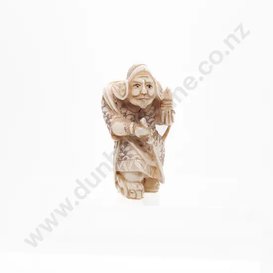 Signed and Stained Ivory Okimono of a Warrior with Sword and Holding a Lantern