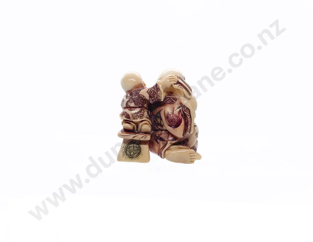 Stained Ivory Netsuke of Hotei with Child Attendant Image 1++