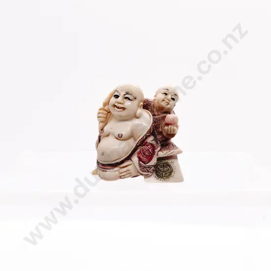 Stained Ivory Netsuke of Hotei with Child Attendant