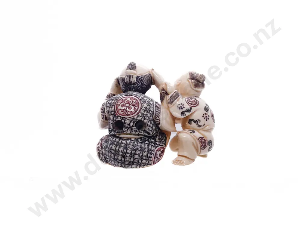 Signed and Stained Ivory Netsuke of a Grandfather Playing with His Grandson Image 1++