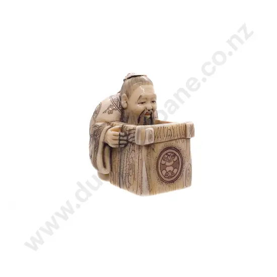 Signed and Stained Ivory Netsuke of a Scholar with Box