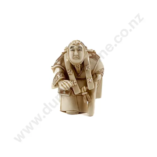 Signed Ivory Netsuke of a Travelling Scholar with Walking Stick and Table on His Back