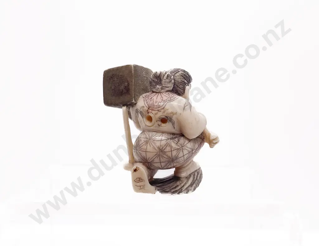 Signed and Stained Ivory Netsuke of a Demon Queller Carrying Box on His Back Image 1++