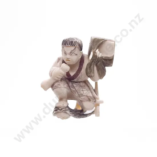 Signed and Stained Ivory Netsuke of a Demon Queller Carrying Box on His Back