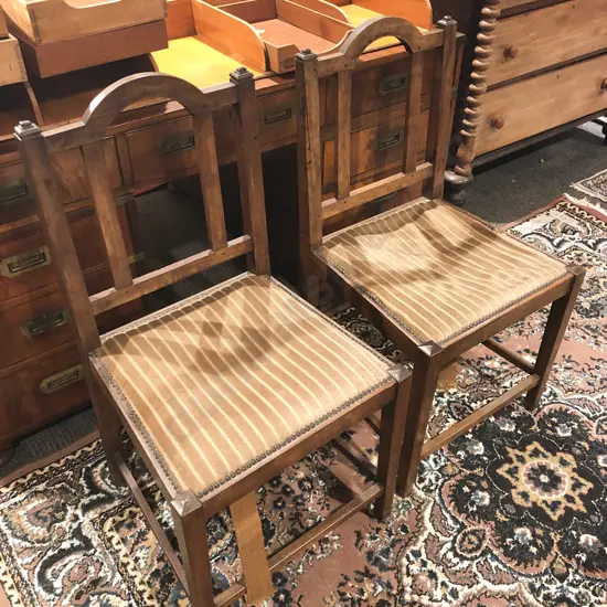 An Interesting Pair of Heavy Teak Dining Chairs
