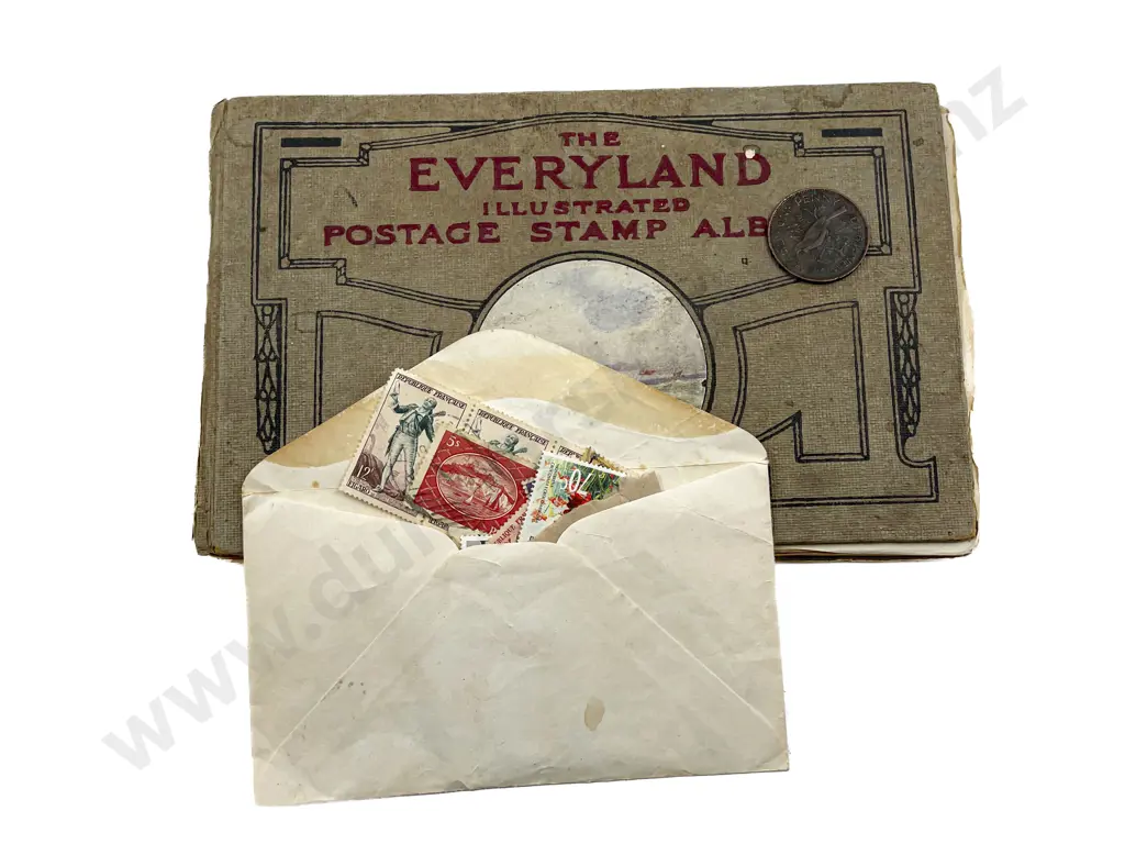 World Stamp Album and Envelope of Assorted Stamps Image 1++