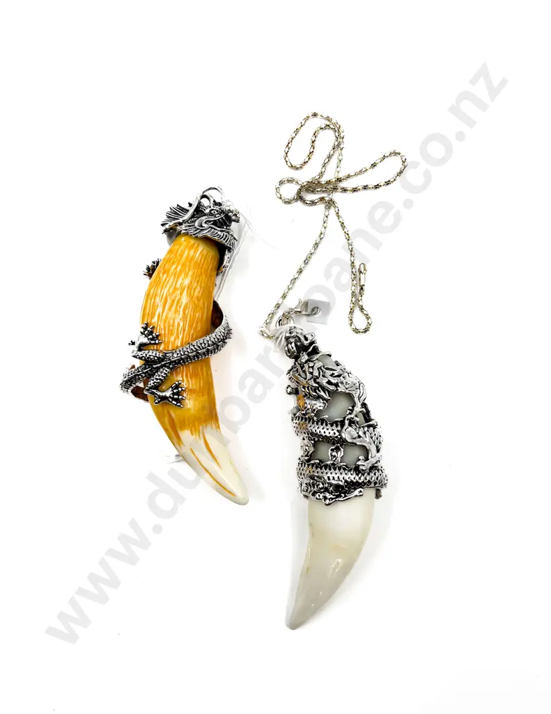 Two Faux Animal Tooth Pendants Image 1++