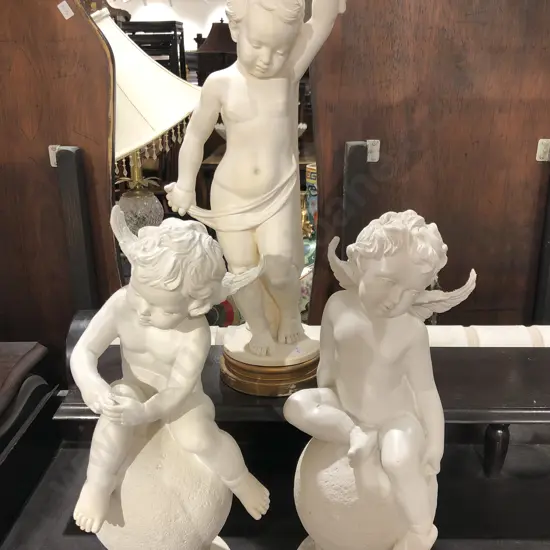 Three Assorted Resin Cherub Ornaments