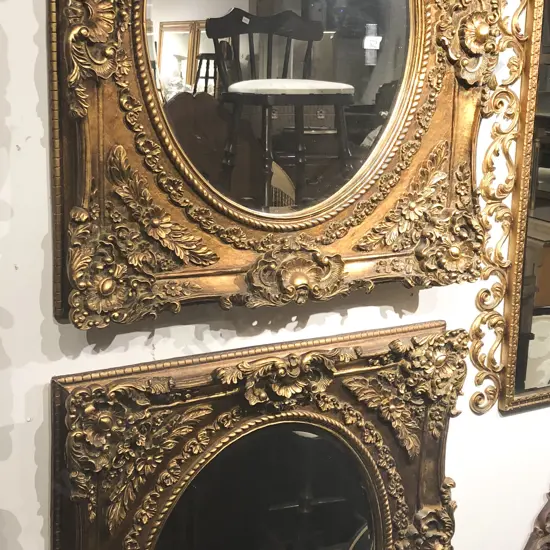 Pair of Ornate Gilt Painted Bevelled Oval Wall Mirrors